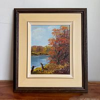 Frontal view of framed oil painting