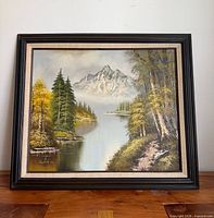Full view of framed landscape oil painting