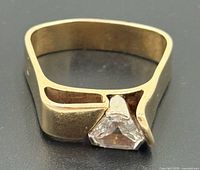 Ring angled to show triangular diamond and open shank