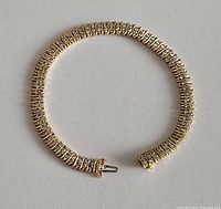 Full view of bracelet laid flat showing overall design and clasp