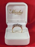 Ring front view in branded box