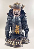 Front view of full Yoroi suit showing helmet, face mask, cuirass, arm guards, and skirt plates