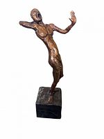 Front view of bronze figure leaning backward on base