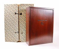 Engraved wooden presentation box and patterned slipcase or carton