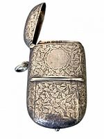 Front view with vesta lid open showing blank cartouche and repousse pattern