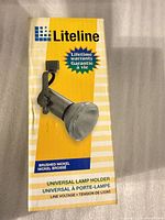 Front of Liteline box showing image of brushed nickel track lamp holder and model information