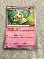 Front of Mimikyu 037/091 holo card showing artwork and details