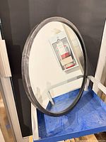 Front view of round mirror showing full frame and glass