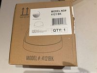 Front of box showing model number 4121BK, quantity 1, black finish diagram of fixture