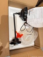 Light fixture components inside original box