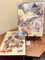 Both mounted PenDelfin prints on display stand