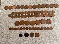All coins laid out in rows showing quantity and size comparison