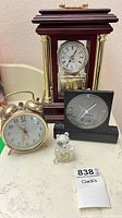 Group shot showing all four clocks together