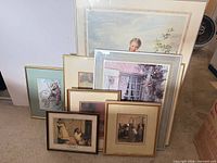 All seven framed prints stacked showing variety of frames and mats