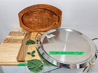All items grouped: stainless griddle, wooden boards, glass board, plaques