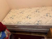 Bed with mattress showing frame beneath