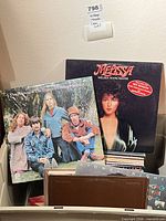 Front view of bin showing The Mamas & The Papas and Melissa Manchester albums on top