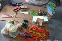 Full overview of all items laid on a cardboard surface including cords, planters, and small accessories.