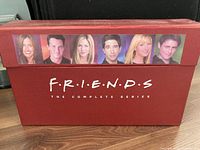 Front of red Friends complete series box showing cast images and logo