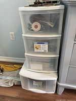 Full view showing Gracious Living 3-drawer tower stacked on Sterilite single drawer