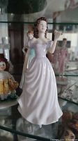 Full front view of Lucy figurine in display cabinet