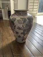 Front view of Toyo porcelain vase showing full shape and floral pattern