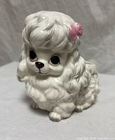 Front view of ceramic poodle planter