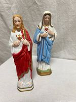 Full view of both porcelain figurines