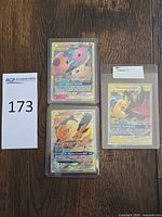 All three Pokémon TAG TEAM GX cards in top loaders