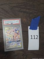 Front view of PSA-slabbed Togepi & Cleffa & Igglybuff GX card showing label and grade