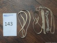 Group shot of all sterling chains with lot card