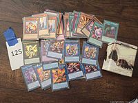 Spread of Yu-Gi-Oh Salamangreat cards with tin and lot tag visible