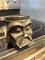 Front view of Darth Vader mug showing facial detailing and surface scuffs