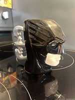 Left profile of Batman head mug showing sculpted detail