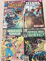Front covers of all four comic books together