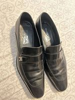 Top view of both loafers showing leather condition, buckle detail, overall design