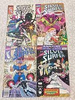 All four Silver Surfer comics laid out