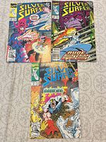 All three Silver Surfer comic books, full covers visible