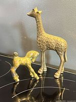 Giraffe and foal figurines front view