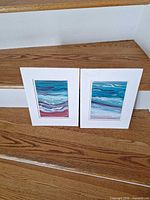 Front view of both matted paintings