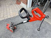 Full side view showing overall edger and cord