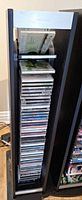 Front view of Brookstone CD tower filled with CDs
