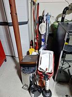 Group shot of all cleaning items in basement corner