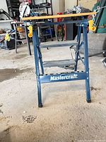 Front view of folding workbench showing steel frame and bamboo top