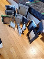 Front view of all frames standing on floor