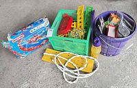 Overall lot with Meccano box, crate of K'NEX pieces, bucket of parts, rope, planks, bottle