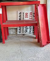 Side view of shelf pair, one shelf panel removed and leaning