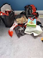 Pile of seven assorted reusable bags showing variety and condition