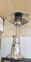Full view of stainless steel patio heater showing reflector, emitter and control tower