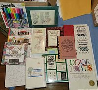 Overview of all items: Sharpies pack, multiple books, coloring books, invitation packs